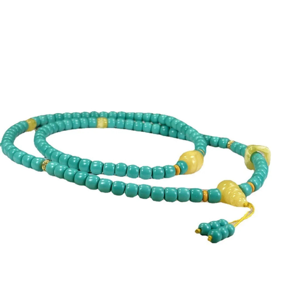 Turquoise lucky pendant necklace with hand-woven mesh flower design on ball bead chain