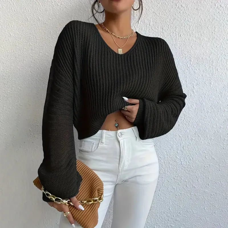 Women's solid colour long sleeve pullover top in polyester, shown in available colours.