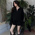 Women's knitted suit set with cable knit sweater and elastic waist shorts in acrylic fabric