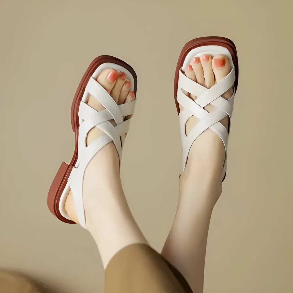 Women's patent leather square toe sandals with cross straps in black colour