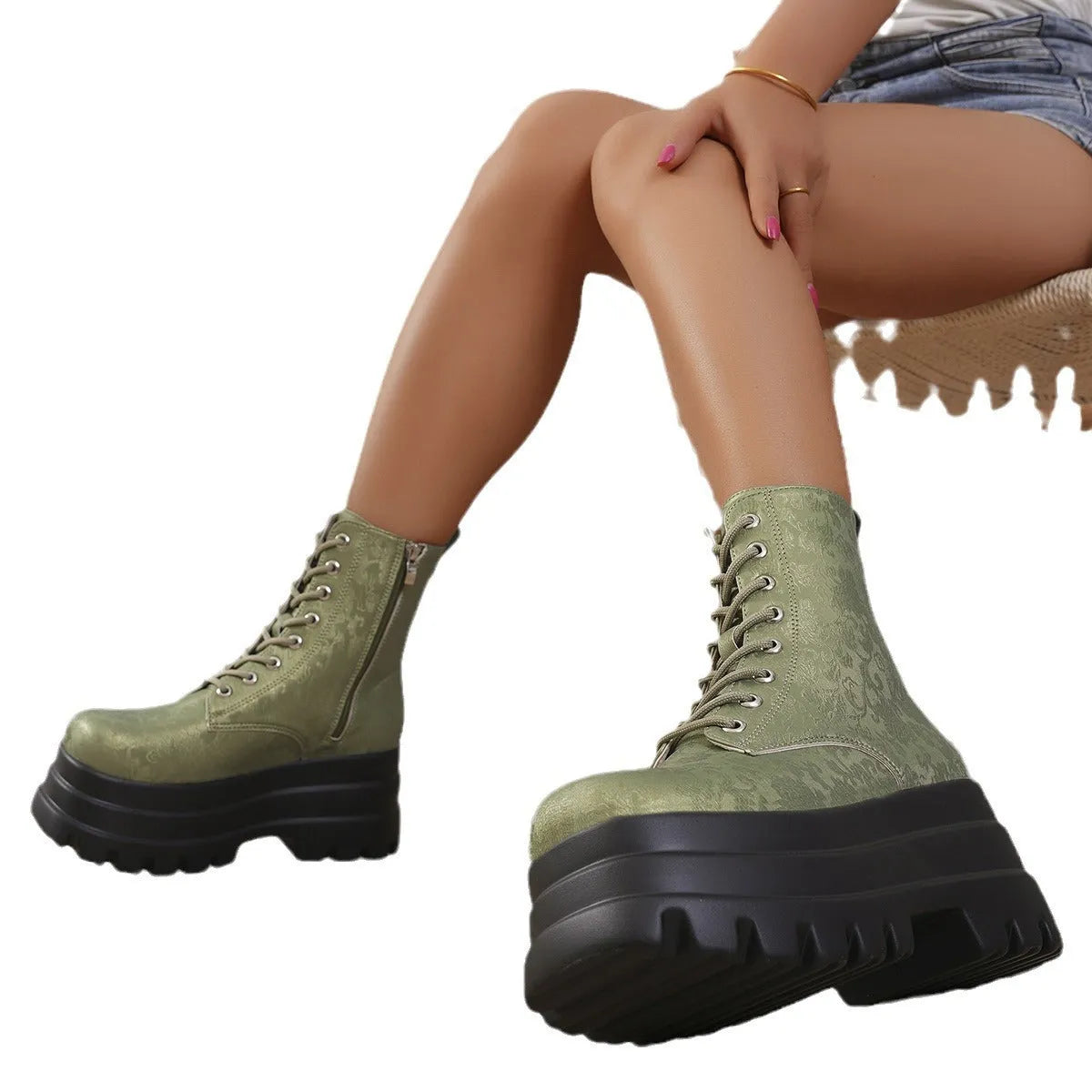 Women's black retro platform boots with patchwork design, chunky heel, and side zipper.