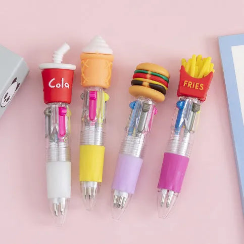 A four-colour ballpoint pen with a press top and a colourful cartoon silicone grip, showing one of five random designs.