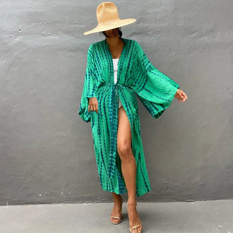 Loose-fitting cotton beach cover-up blouse in a printed pattern, shown in a rust red colour.