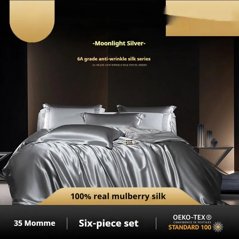 Silk four-piece quilt cover set in solid colour with fitted or flat sheet options for UK bed sizes.