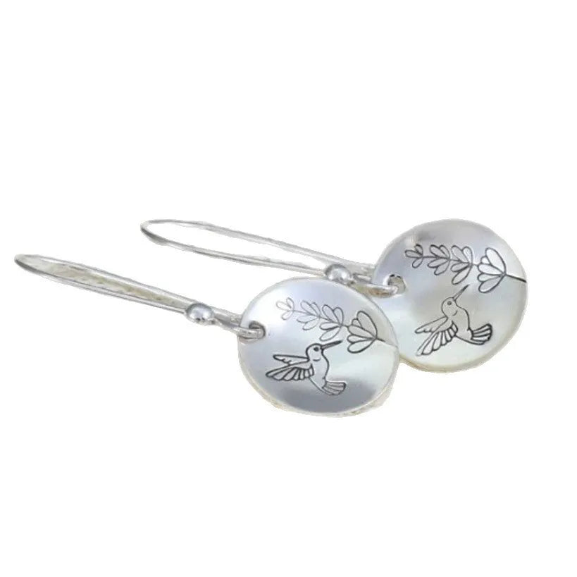 Women's silver bird motif earrings with leaf accents and glossy round components