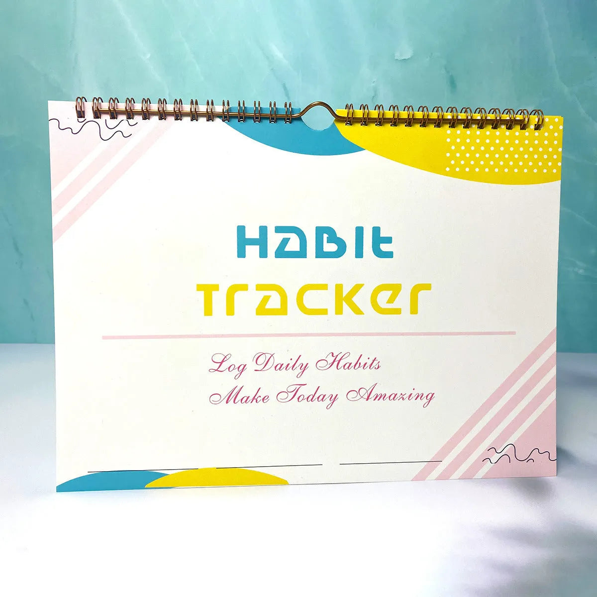 Habit tracking device showing 12 internal pages for schedule planning in various colour options