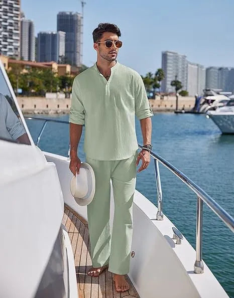 Men's casual cotton suit set in a solid colour, featuring a long-sleeved top and matching trousers.