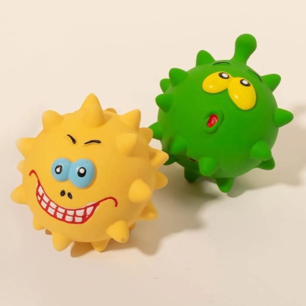 Four colourful squeaky dog balls with cute faces on natural latex rubber with bumpy dental-cleaning surface