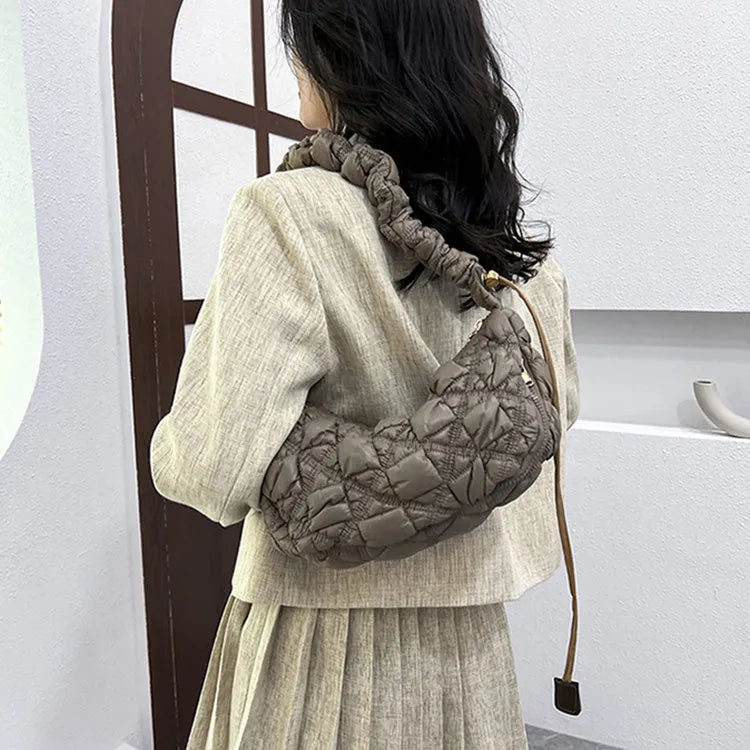 Women's casual nylon messenger bag in beige colour, showing front view with shoulder strap.