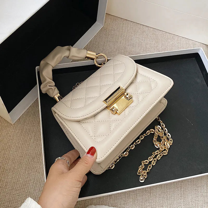 Korean-style rhombus shoulder bag in purple with crossbody strap and small square design