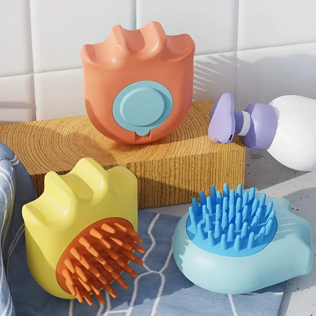 Blue pet bath brush with massage comb head and integrated shampoo box for washing dogs and cats.