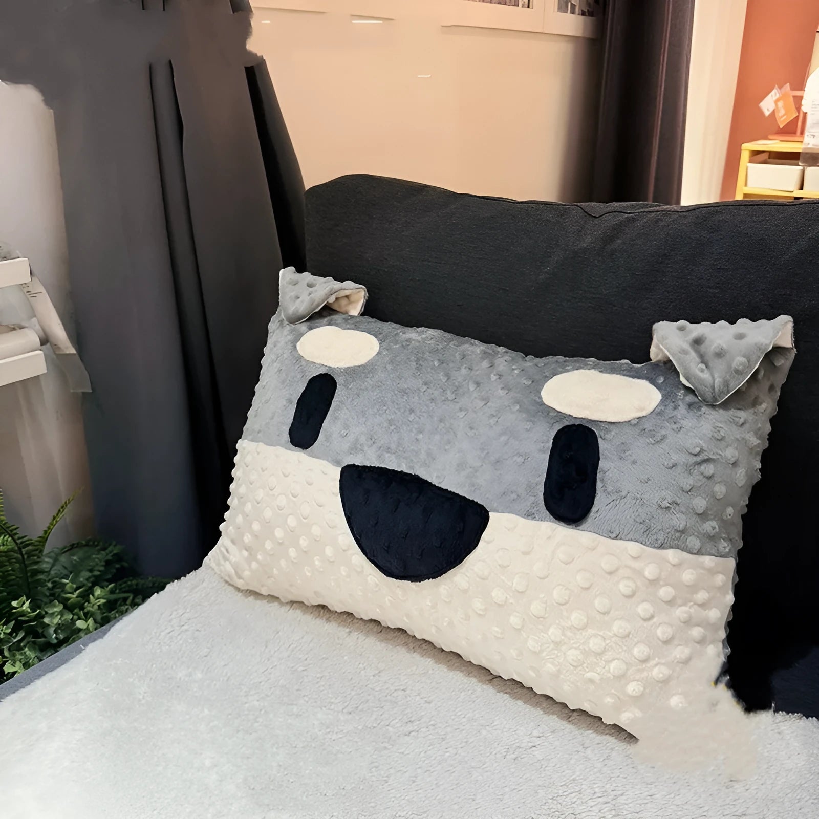 West Highland puppy decorative cushion on sofa, grey and white dog design