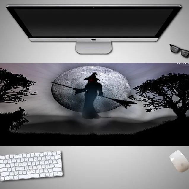 Oversized Halloween-themed computer mouse pad with non-slip rubber cloth base on a desk