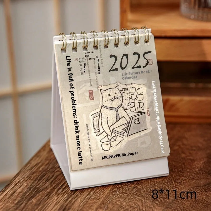 Mini A5 desk calendar 2025 showing one of eight themed designs in simple modern style