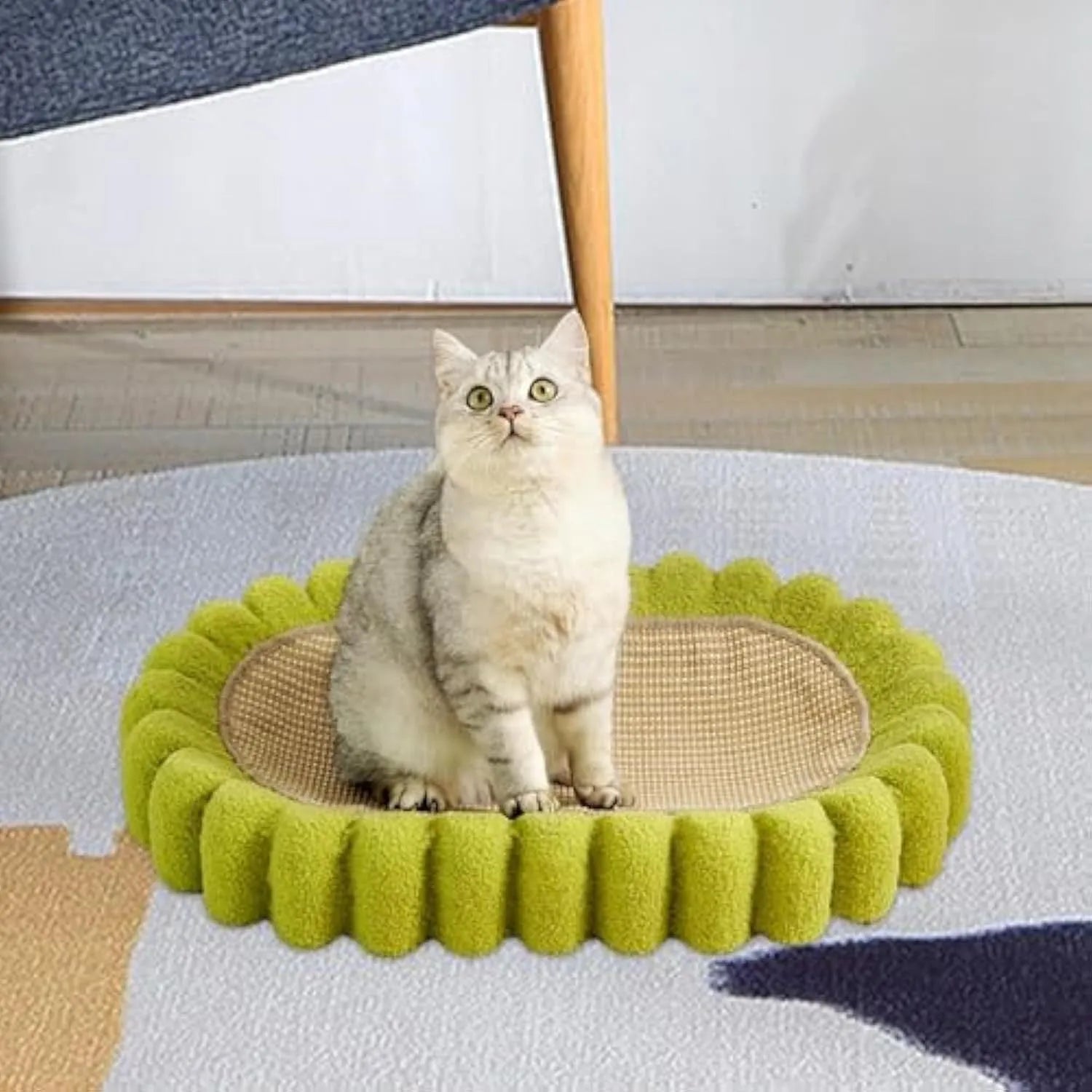 Green oval sisal cat scratcher bed measuring 650mm with scratching surface and lounging area