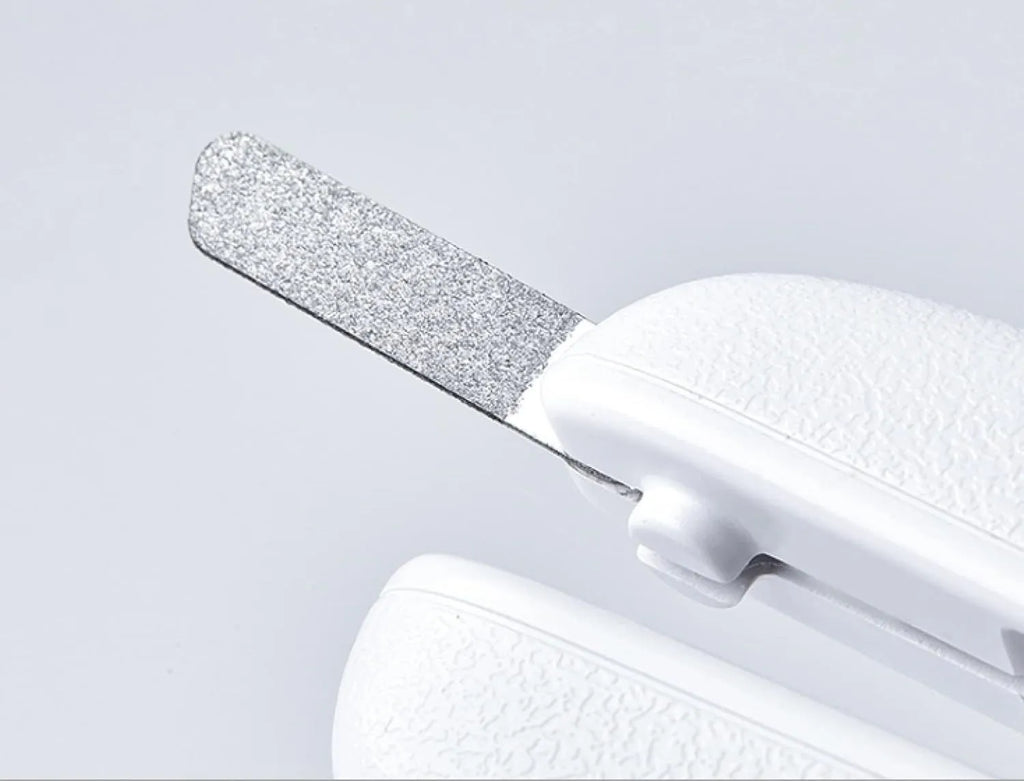 White LED pet nail clippers with open anti-splash guard and nail file on a solid colour background