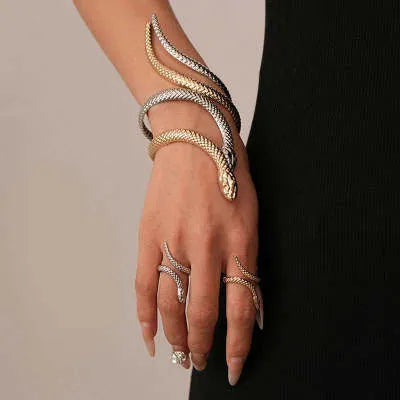 Gold twisted snake design ring and bracelet jewellery set with exaggerated winding metal construction