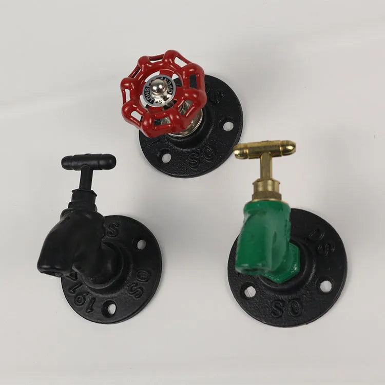 Metal wall-mounted towel rack hook designed like a water pipe, in a polished finish.