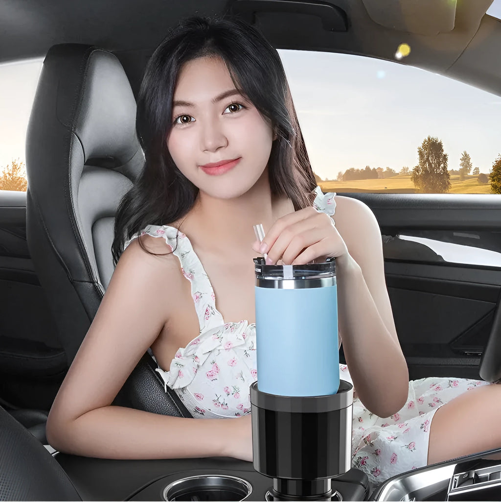 Matte black adjustable car cup holder expander for large bottles and travel mugs.