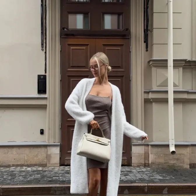 White thick knit polyester cardigan jacket with long sleeves and loose fit