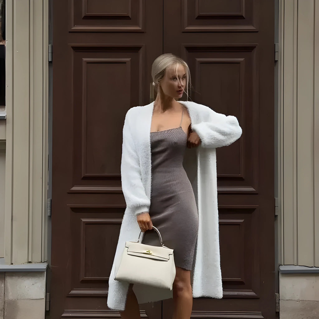 White thick knit polyester cardigan jacket with long sleeves and loose fit