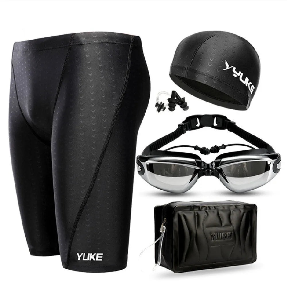 Men's five-piece swimming set showing black trunks, goggles, cap, ear plugs, nose clip, and carry bag.