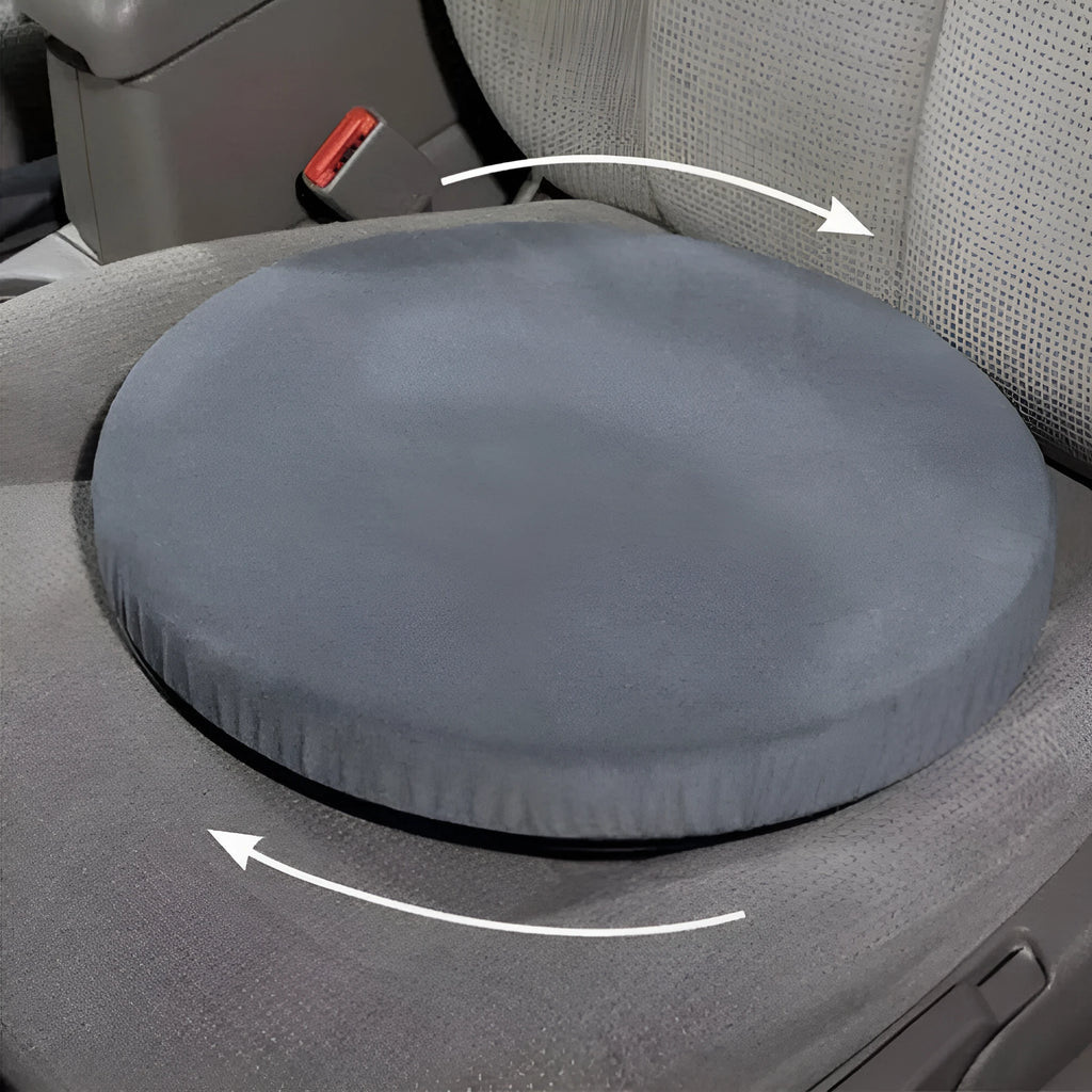 Circular grey rotating car seat cushion with plush fabric on a car seat.