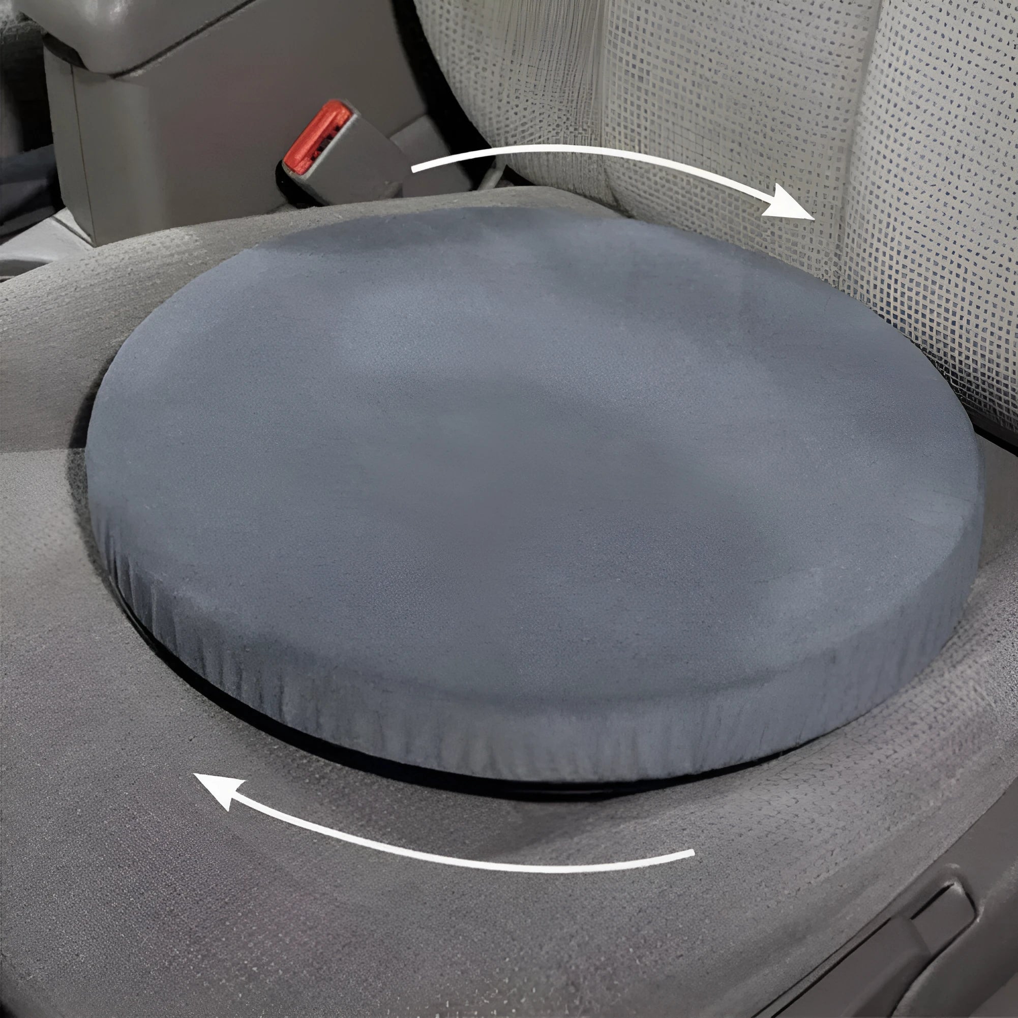 Circular grey rotating car seat cushion with plush fabric on a car seat.