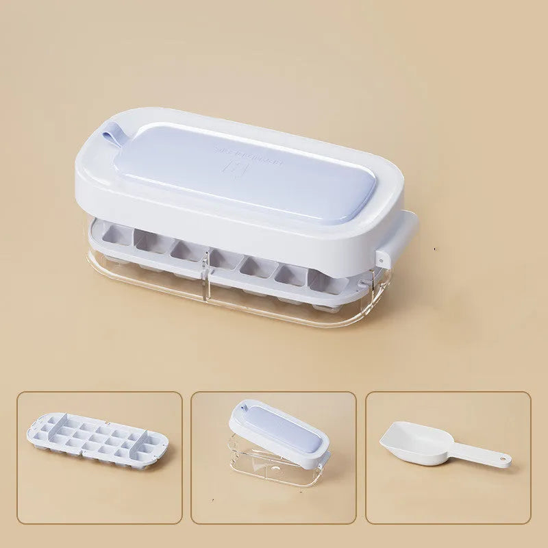 Yellow lever-operated ice cube tray grid with high capacity design and stored ice shovel.