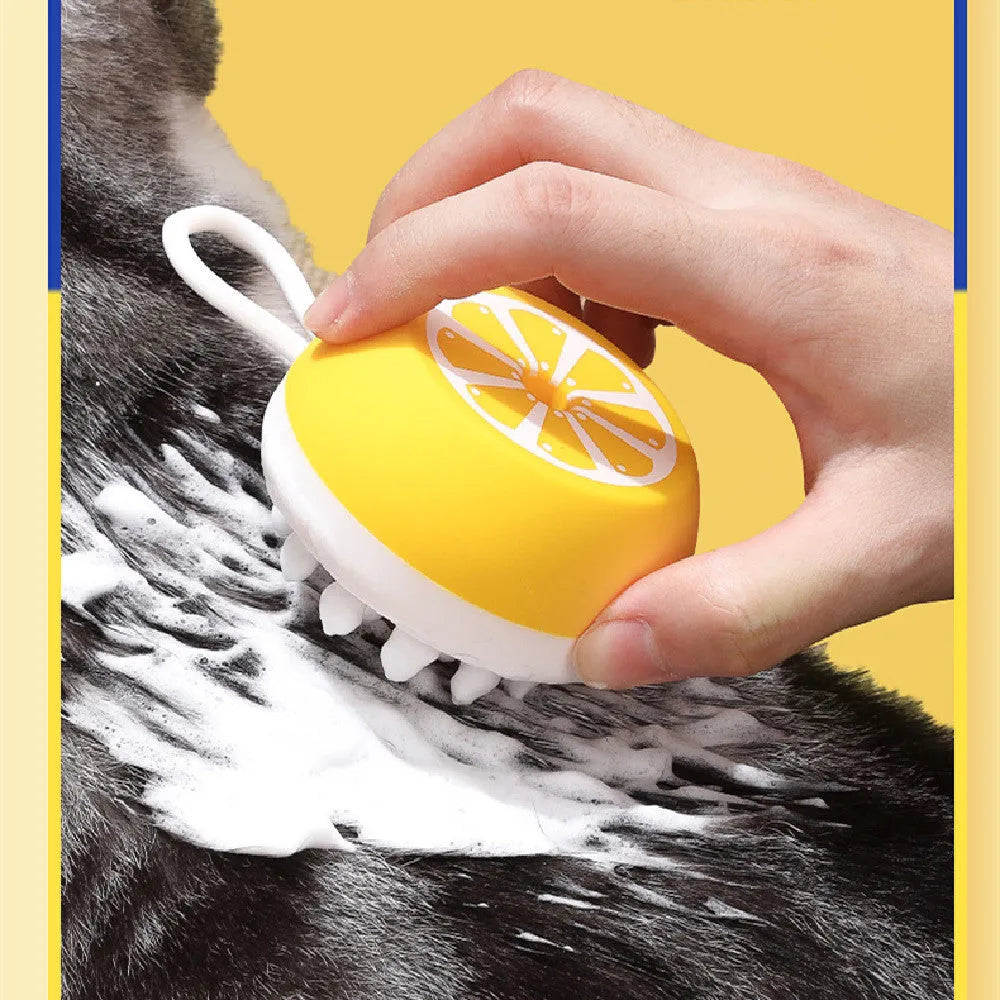 Soft yellow silicone pet bath brush with massage nodes and comb bristles for dog and cat washing.