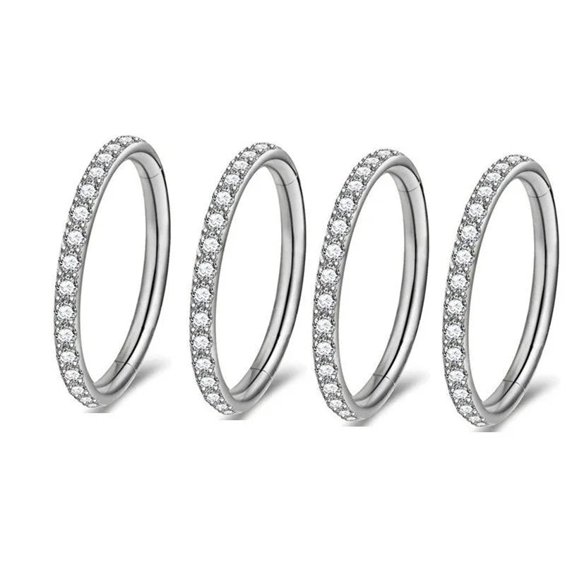 A round stainless steel seamless nose ring shown in gold, rose gold, black, and steel colour finishes.