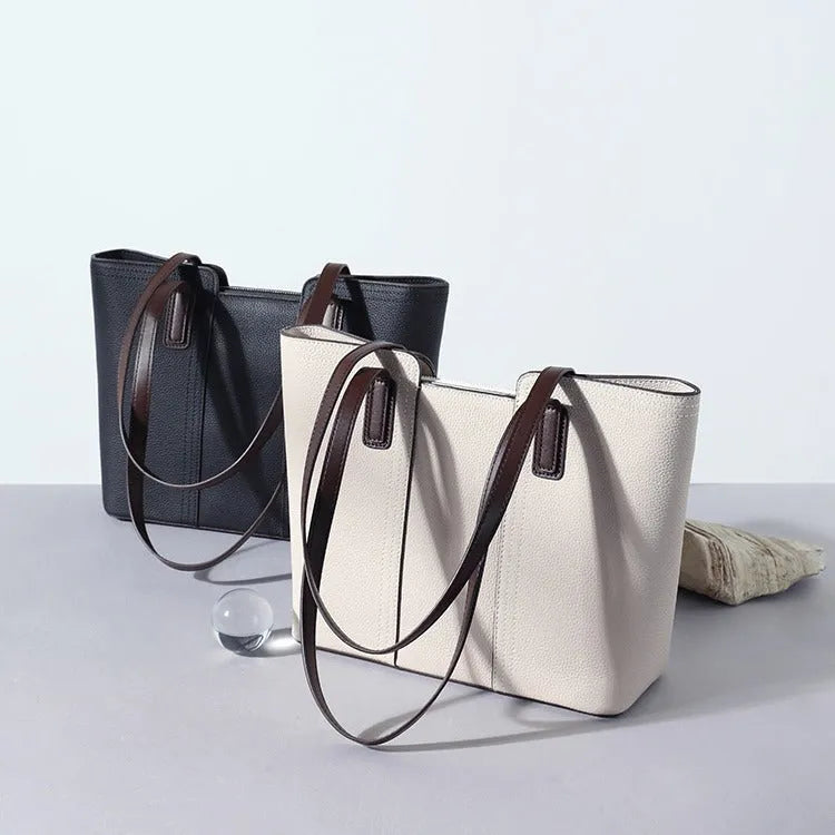Women's genuine leather large capacity shoulder bag in khaki colour with visible sewing lines and a structured box shape.