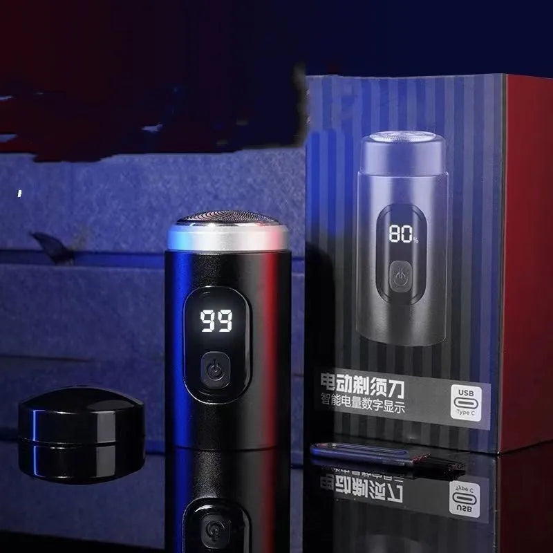 Black mini portable rechargeable shaver with USB cable and cleaning brush on a white background.