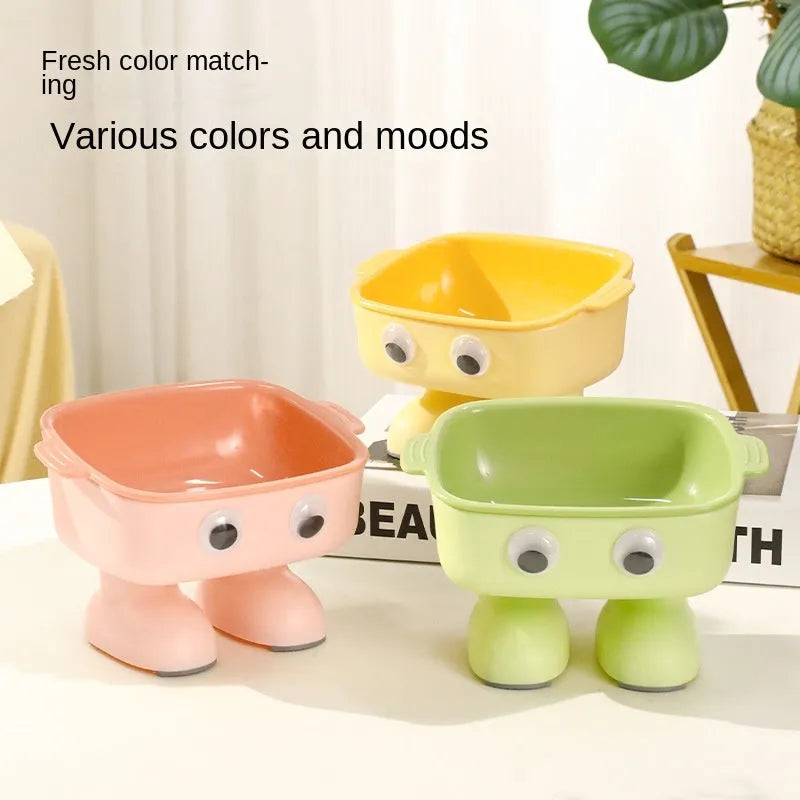 Elevated robot-shaped cat bowl with tilted design and detachable inner bowl in green colour