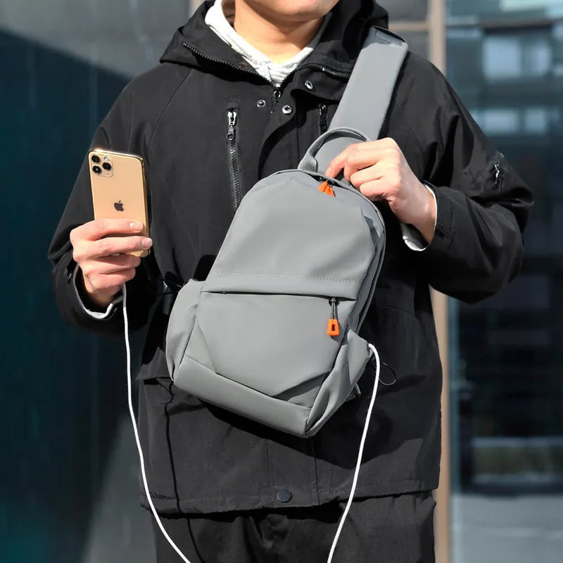 Men's black polyester crossbody bag with adjustable strap and simple casual styling