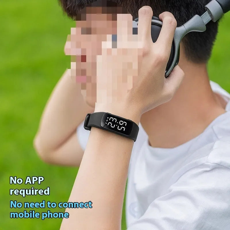 Waterproof vibration alarm clock watch with black silicone strap and LED display showing time
