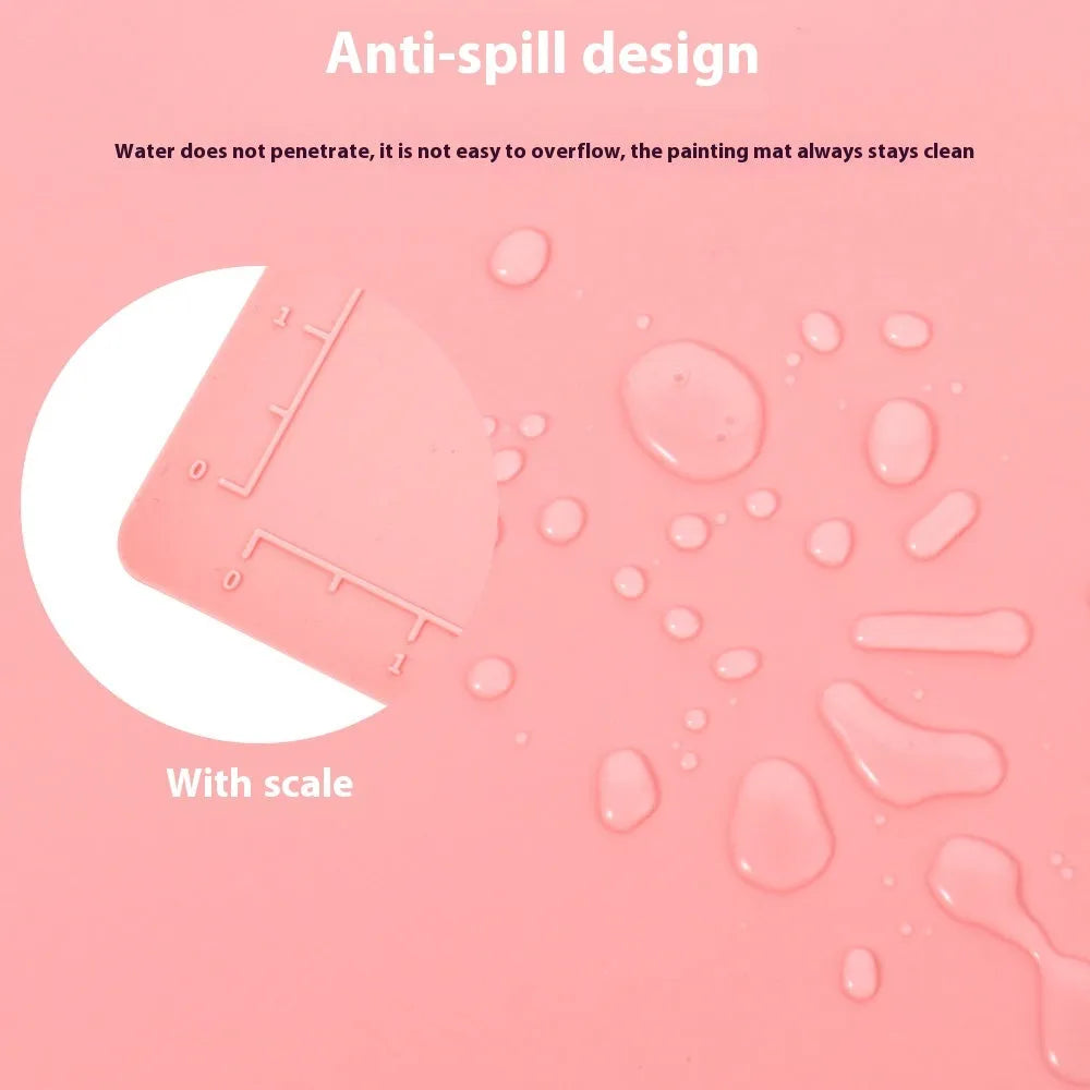 Green silicone painting mat measuring 50x40cm with two round paint mixing bowls on the surface.