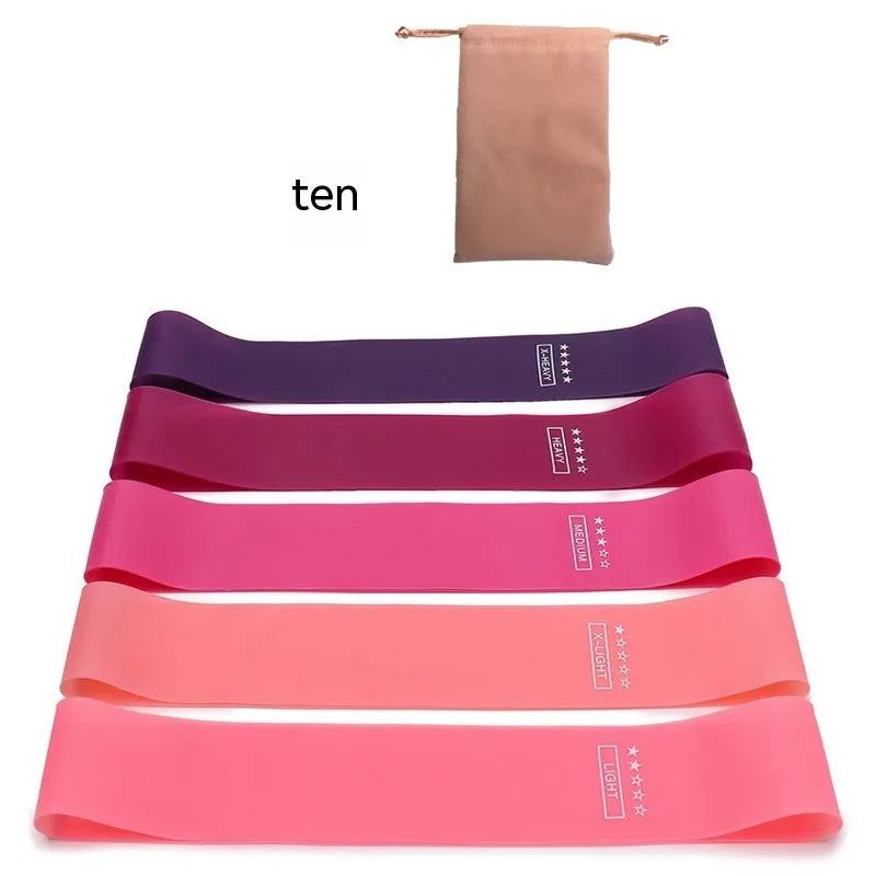 Five colour-coded TPE yoga tension straps with graduated thickness for resistance training