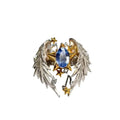 Gold-tone geometric angel wings alloy ring with adjustable opening on a finger.