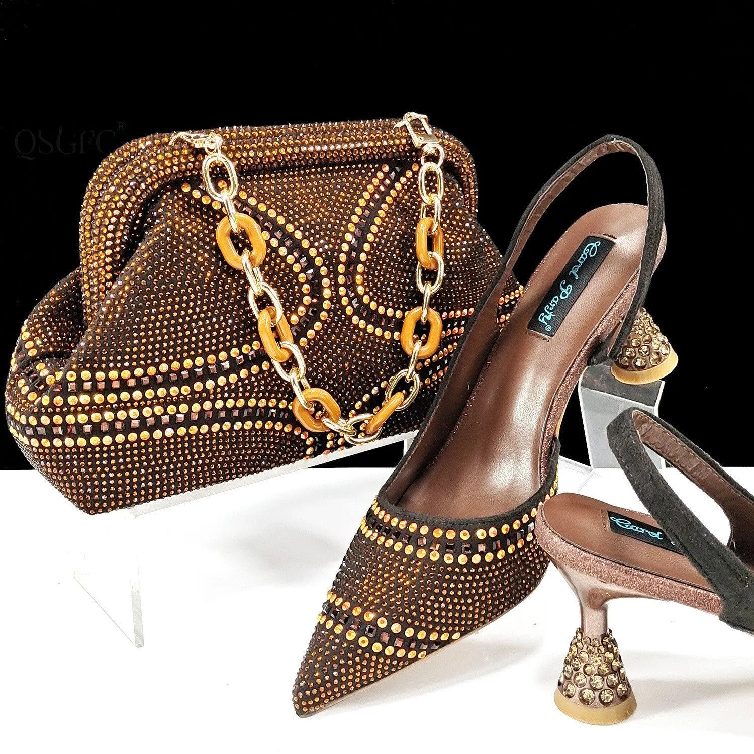 Women's pointed-toe high heel shoes with matching bag, featuring a stiletto heel and rhinestone detail on a synthetic leather upper.