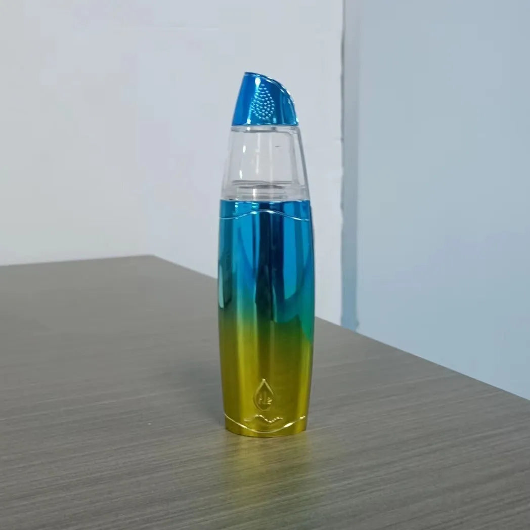 Peacock blue handheld USB-rechargeable facial steamer device on a white background.