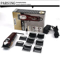 Cordless charging hair clipper set with stainless steel cutter head on a table.