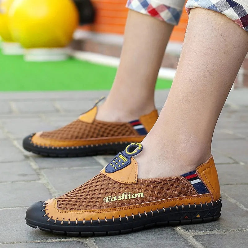 Men's brown casual shoes with mesh upper and rubber sole, showing round toe and stitching detail
