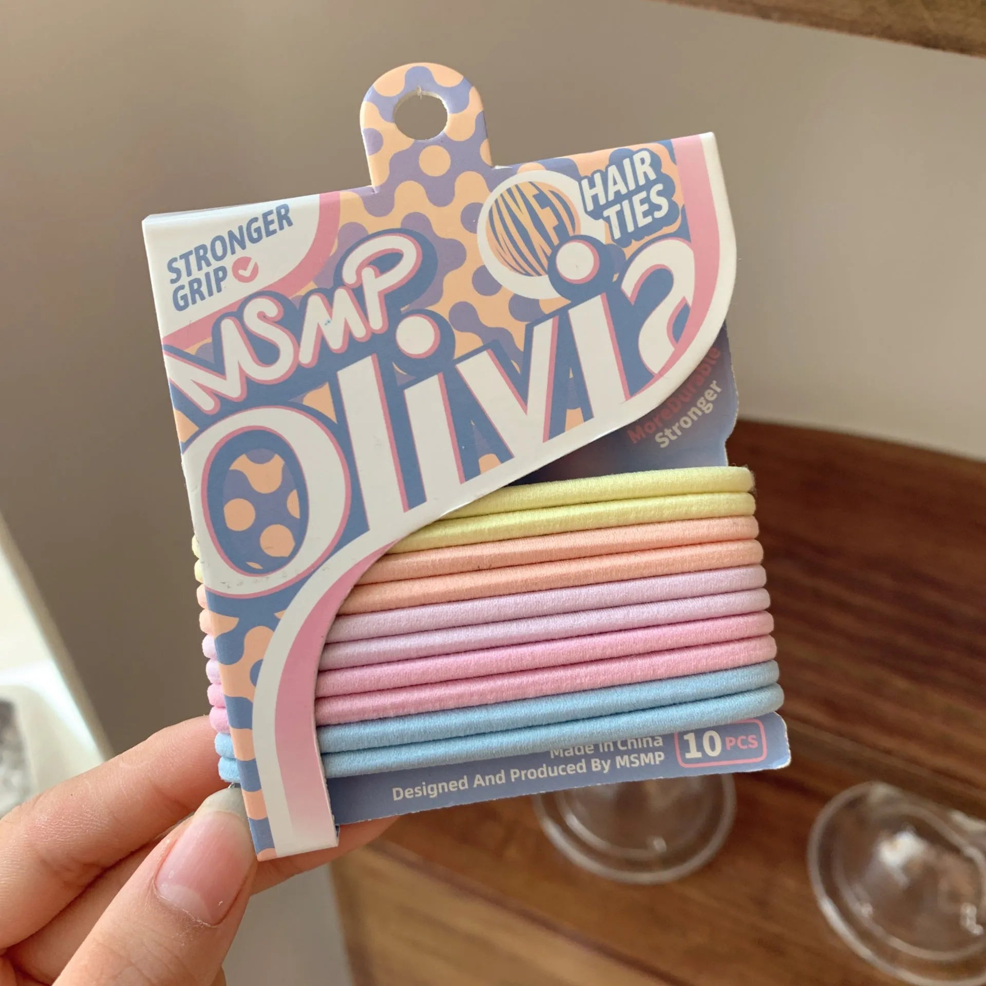 Assorted candy colour braided elastic hair bands for men and women on a white background.
