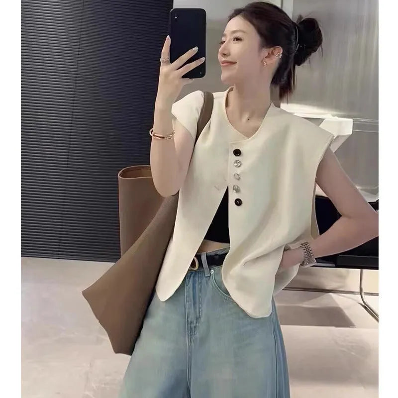 Women's loose-fit polyester vest in milky white with a pocket, shown on a hanger.