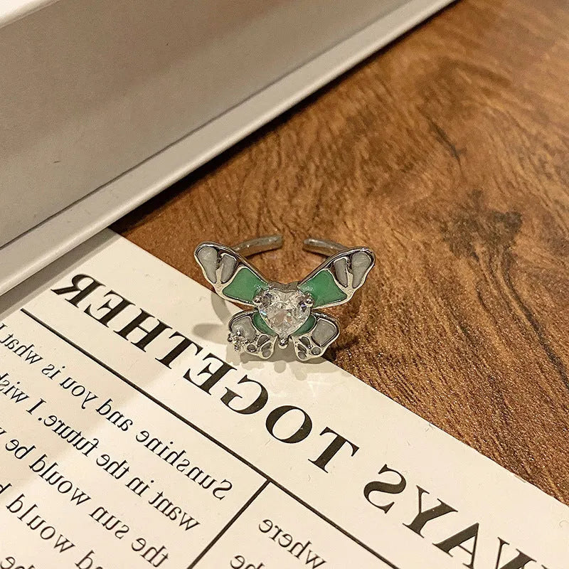 Women's copper butterfly ring with dripping oil finish and adjustable open loop design