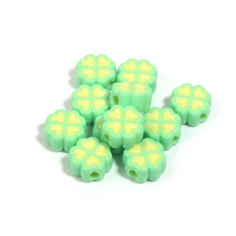 Acrylic four-leaf clover beads with frosted finish in mixed cartoon colours