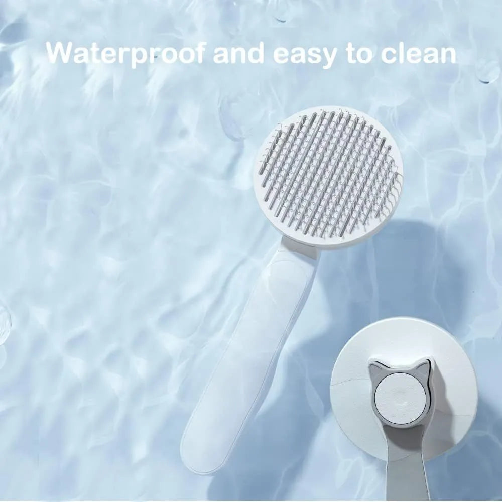 Blue self-cleaning cat and dog brush with rubber-tipped pins and a non-slip handle on a white background.