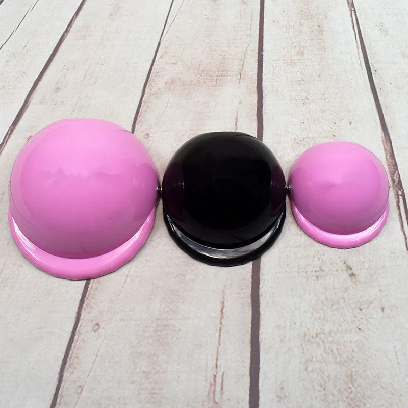 Solid colour plastic dog motorcycle helmet cap in Japanese South Korea style on a pink background.