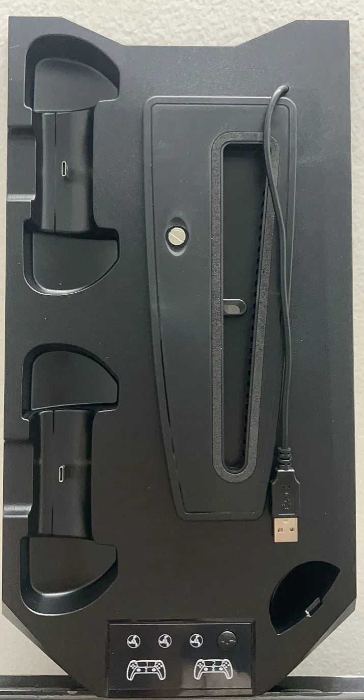White PS5 charging dock and cooling base station with controllers and headset on display